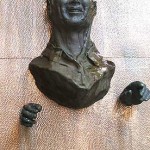 Bronze Man on Water Wall